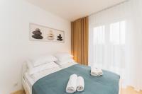 Posteľ alebo postele v izbe v ubytovaní Apartament SUBMARINE SurfingBird Dźwirzyno