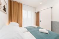 Posteľ alebo postele v izbe v ubytovaní Apartament SUBMARINE SurfingBird Dźwirzyno