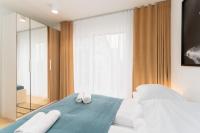 Posteľ alebo postele v izbe v ubytovaní Apartament SUBMARINE SurfingBird Dźwirzyno