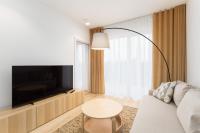 Televízia a/alebo spoločenská miestnosť v ubytovaní Apartament SUBMARINE SurfingBird Dźwirzyno