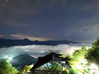 a house on top of a mountain at night at Naluwan Villa in Ren&#39;ai