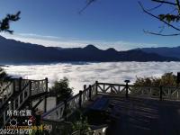 a view from the top of a mountain above the clouds at Naluwan Villa in Ren&#39;ai