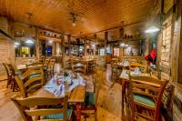 a dining room with wooden tables and chairs at Land gut Hotel Hermann in Bentwisch