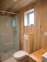 a bathroom with a shower and a toilet and a sink at Domaine St-Amand in Saint-Amand-de-Coly