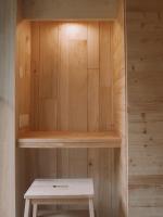 a sauna with a bench in a wooden wall at Domaine St-Amand in Saint-Amand-de-Coly