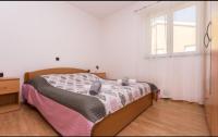 Posteľ alebo postele v izbe v ubytovaní Apartments Kraljić I