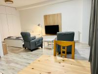 A television and/or entertainment centre at Apartmán Liptov NP9
