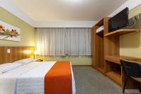 Tri Hotel Executive Caxiasにあるベッド