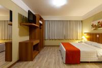 Tri Hotel Executive Caxiasにあるベッド