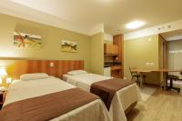 Tri Hotel Executive Caxiasにあるベッド