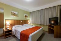 Tri Hotel Executive Caxiasにあるベッド