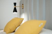Posteľ alebo postele v izbe v ubytovaní Apartamentos Debambú