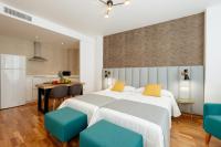 Posteľ alebo postele v izbe v ubytovaní Apartamentos Debambú
