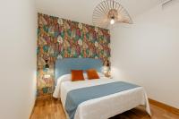Posteľ alebo postele v izbe v ubytovaní Apartamentos Debambú
