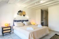 Posteľ alebo postele v izbe v ubytovaní Aquileria Seaview Pool Villa - Seven Bedrooms