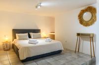 Posteľ alebo postele v izbe v ubytovaní Aquileria Seaview Pool Villa - Seven Bedrooms