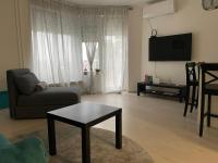 Televízia a/alebo spoločenská miestnosť v ubytovaní Studio apartman Rita