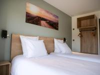 Posteľ alebo postele v izbe v ubytovaní Motel 991