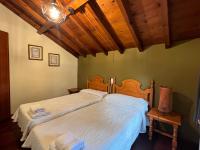 A bed or beds in a room at Complejo la Regalina