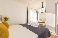 Postel nebo postele na pokoji v ubytování Suncanarias Hotel Adeje Plaza