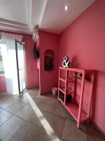 A television and/or entertainment centre at RaRoom Colors
