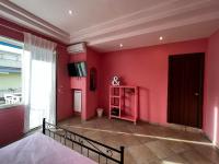 A television and/or entertainment centre at RaRoom Colors