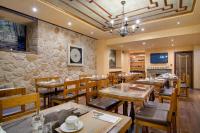 Reštaurácia alebo iné gastronomické zariadenie v ubytovaní Hotel Kassaros