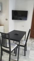 Televízia a/alebo spoločenská miestnosť v ubytovaní CASA MORENA MiA APARTAMENTOS