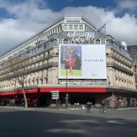 a large building with a large billboard in front of it at Cozy - Free Parking - 15mn from Paris Montparnasse in Clamart