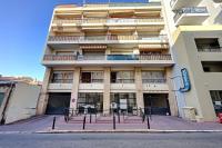 a tall building with a parking lot in front of it at Cosy Studio Cannes Center beaches shopping and congresses LIVE IN MERLE in Cannes