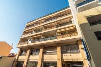 a tall building with a balcony on the side of it at Cosy Studio Cannes Center beaches shopping and congresses LIVE IN MERLE in Cannes