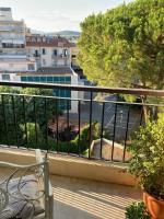 a balcony with a bench and a view of a street at Cosy Studio Cannes Center beaches shopping and congresses LIVE IN MERLE in Cannes