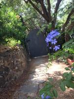 A garden outside VILLA VITTORIA with PRIVATE HEATED SWIMMING POOL COMPLETE WITH HIDROMASSAGE FOR EXCLUSIVE USE , SEA VIEW, 150 METERS FROM THE BEACH
