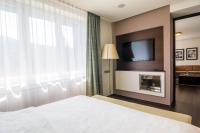 Postel nebo postele na pokoji v ubytování Spa hotel Lanterna