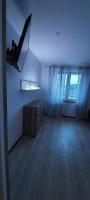 Televízia a/alebo spoločenská miestnosť v ubytovaní Bacio-Bacio Apartamenty