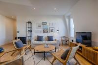 Televízia a/alebo spoločenská miestnosť v ubytovaní La Villa Suzanne - Two Bedrooms - Deauville Beach