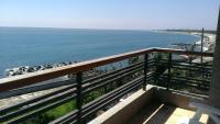 a balcony with a view of the beach and the ocean at Sea Bay in Taitung City