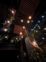 a room with potted plants and lights on the ceiling at H Hotel El Nido - Vegan Friendly Hotel Managed by H Hospitality Group in El Nido