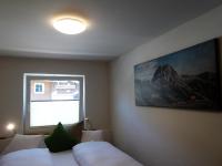 Łóżko lub łóżka w pokoju w obiekcie Bhome Gästehaus b&b / Apartments