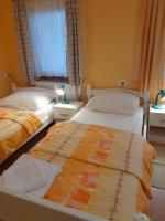 Postel nebo postele na pokoji v ubytování Apartman Peric