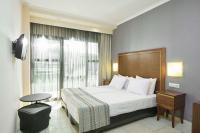 A bed or beds in a room at Mediterranean Resort
