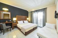 A bed or beds in a room at Mediterranean Resort