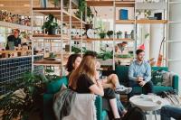 a group of people sitting in a room at Zoku Copenhagen in Copenhagen