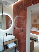 Posteľ alebo postele v izbe v ubytovaní Intense Boutik-Hôtel