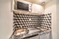 Kuchyňa alebo kuchynka v ubytovaní Bel appartement au coeur de Montmartre