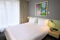Ein Bett oder Betten in einem Zimmer der Unterkunft Park Plaza Berlin