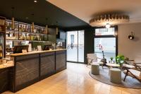 a bar in a restaurant with chairs and tables at ibis Paris Bastille Faubourg St Antoine in Paris