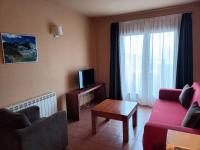 Televízia a/alebo spoločenská miestnosť v ubytovaní Aparthotel Bellver