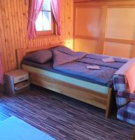 Postel nebo postele na pokoji v ubytování APARTMA-SPA NATURA