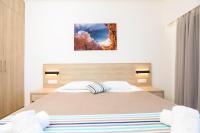 Posteľ alebo postele v izbe v ubytovaní Passas Mare Apartments & Studios
